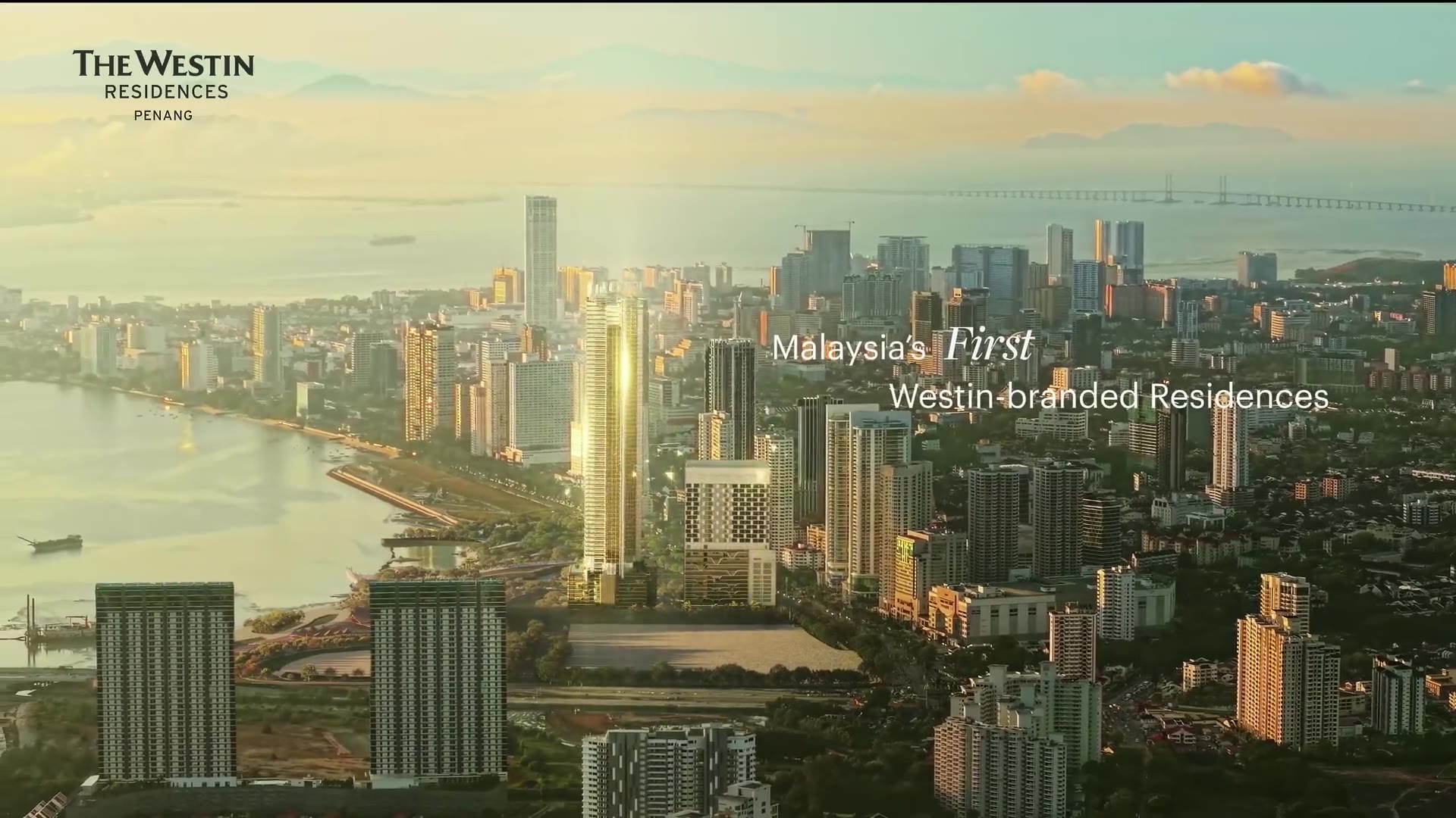 The Westin Residences tower rising above the Penang skyline over Gurney Bay at golden hour