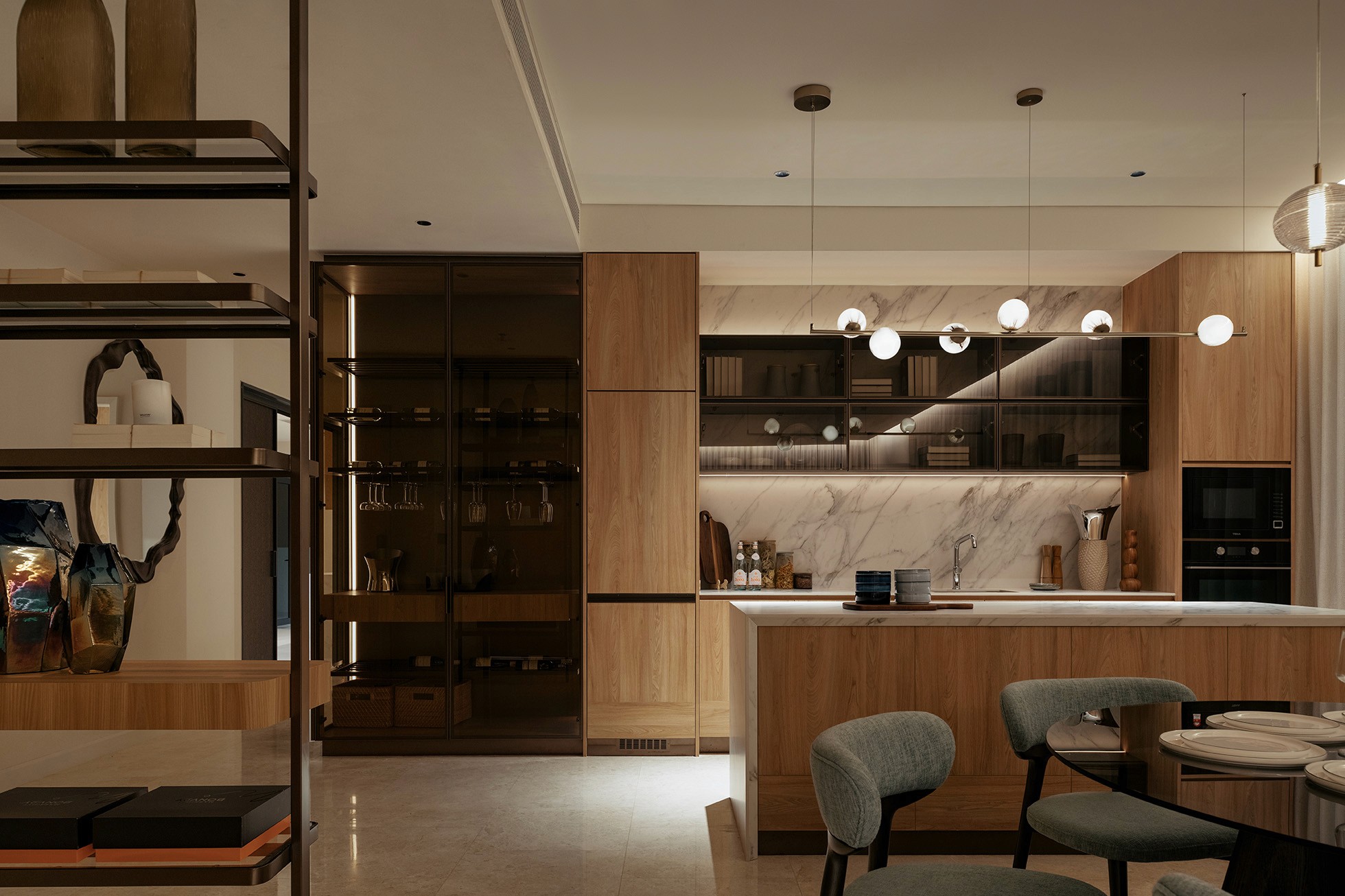 Dry kitchen and bar with glass display cabinetry and pendant lighting — The Westin Residences show unit