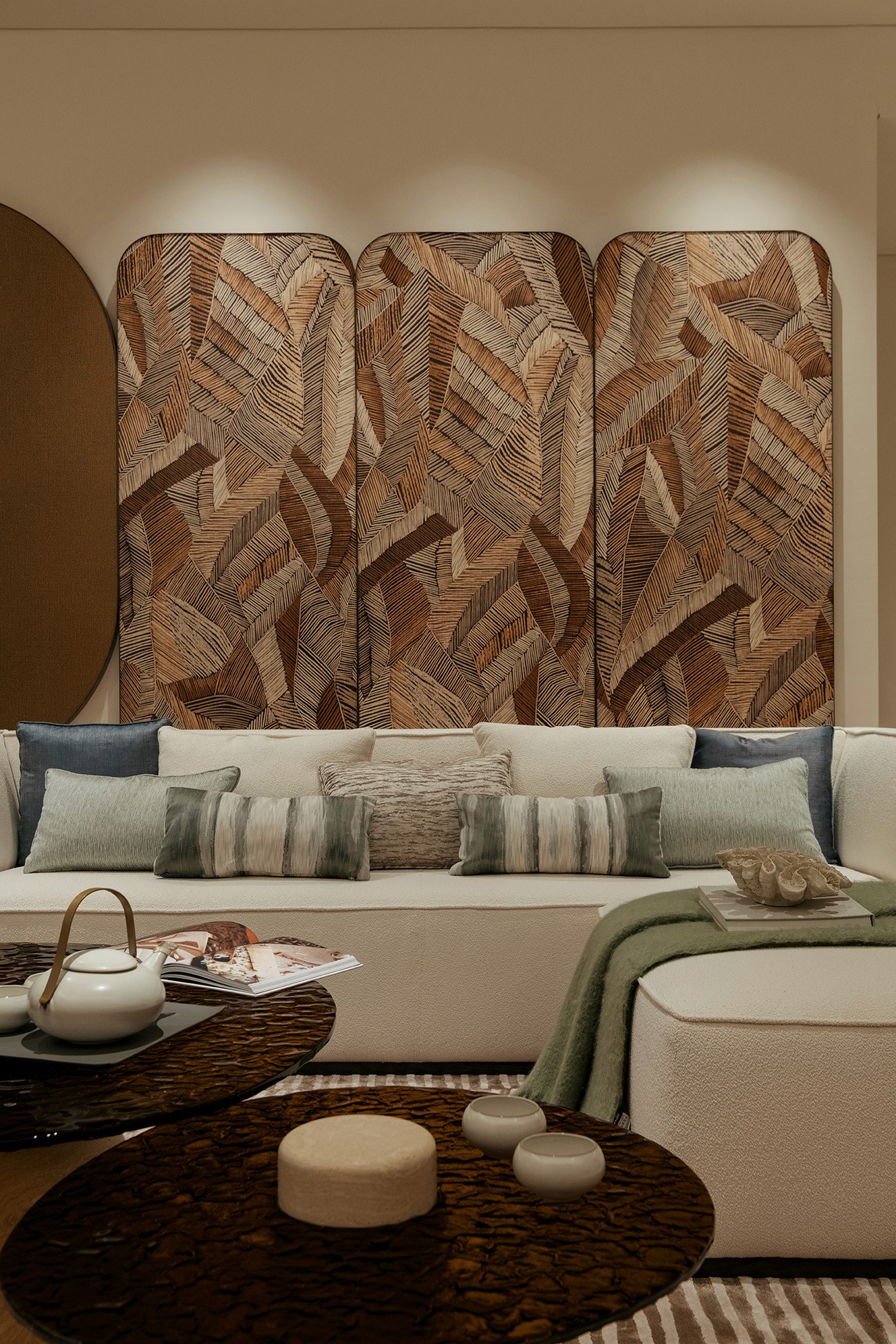 Lounge corner with carved timber panelling and boucle sofa — The Westin Residences show unit